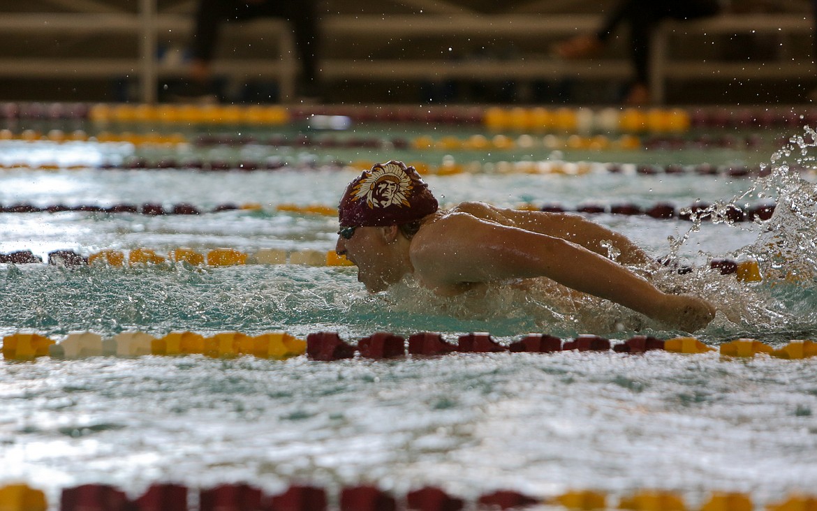 Cole Lindberg makes his way across the pool in the 100 yard butterfly event on Thursday afternoon at Moses Lake High School.