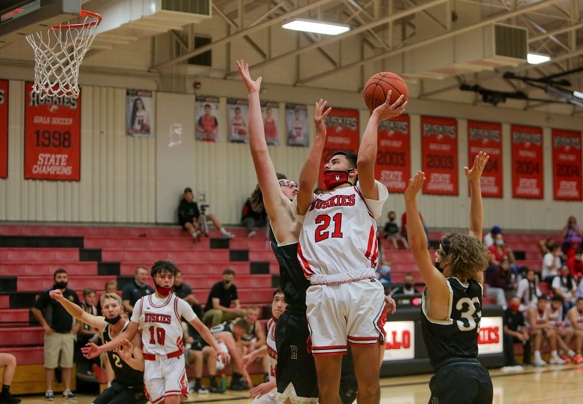 Othello High School's Sonny Asu goes up for a shot in the paint in the second half on Saturday afternoon against visiting Royal High School.