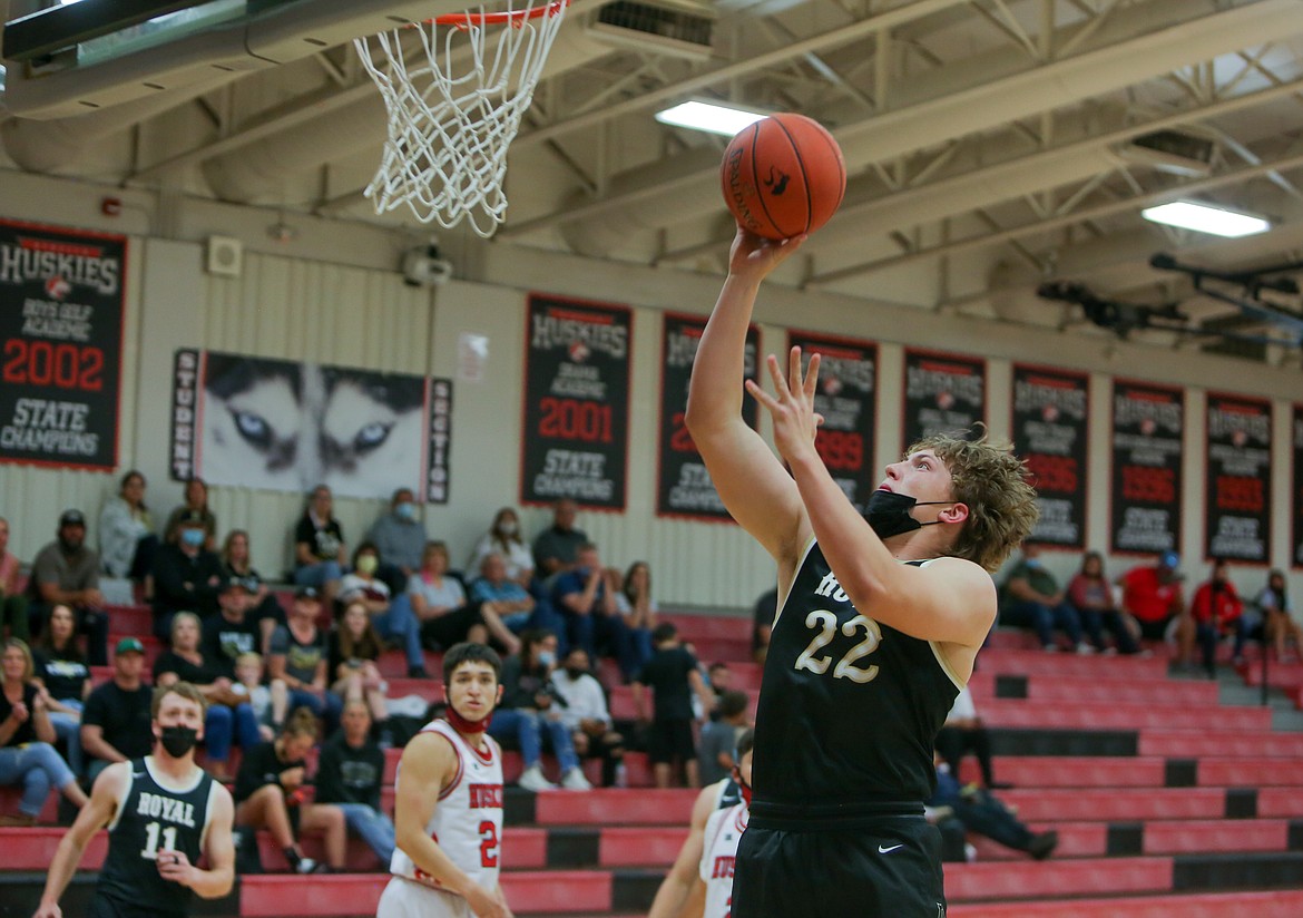 Royal High School's Avery Ellis goes up for a basket early in the first half for the Knights against Othello High School on Saturday afternoon.