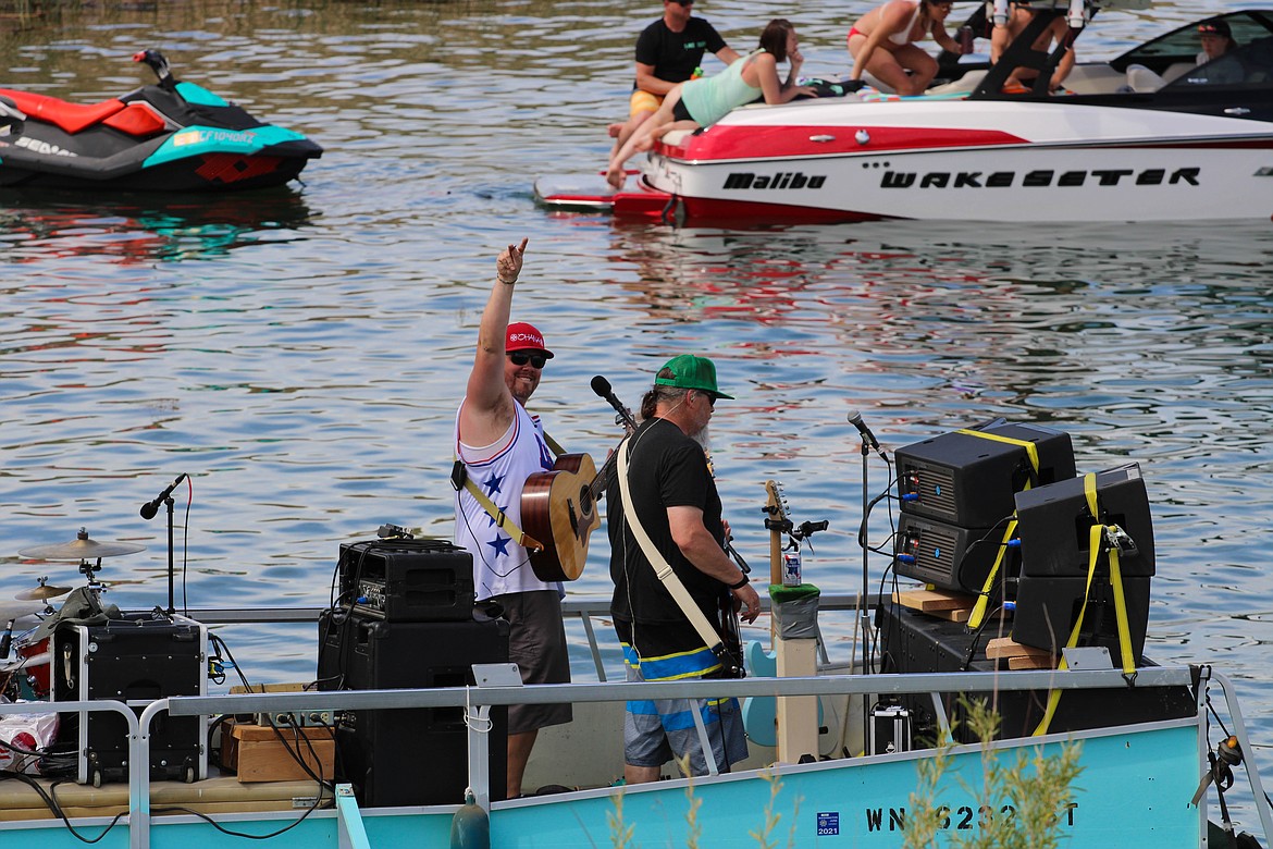 Dimestore Prophets lead vocalist Ray Glover, left, smiles wide at Tunes at the Dunes in Moses Lake on Sunday.