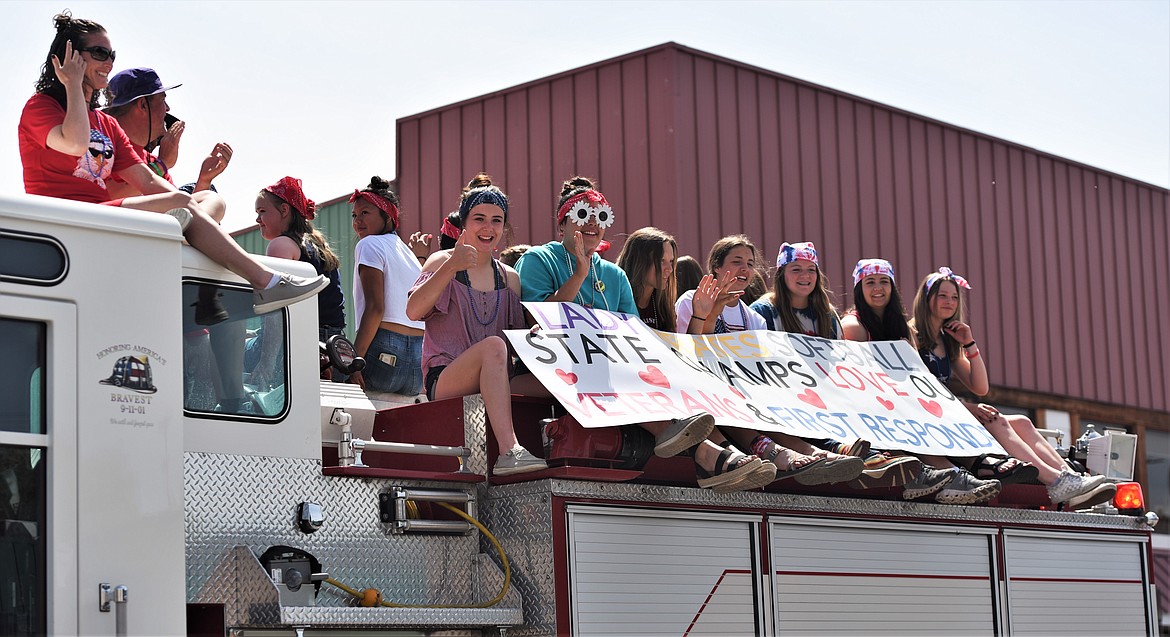 The Class A state champion Polson girls softball team participated in a Memorial Day parade Monday. (Scot Heisel/Lake County Leader)