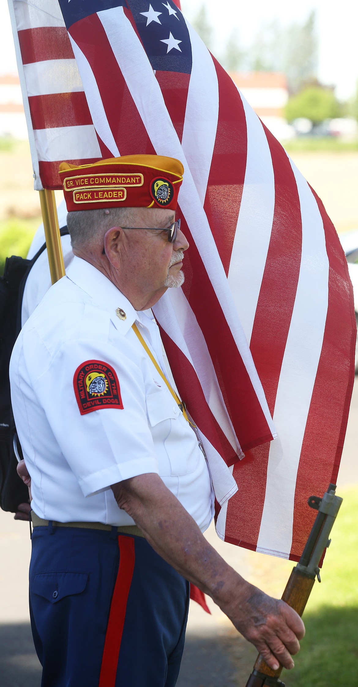 Veteran Tom Wambolt stands with his rifle on Monday at Coeur d'Alene Memorial Gardens.