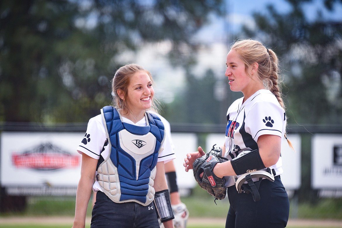 Catcher Jerny Crawford and pitcher Liev Smith talk during their 6-5 win over Stillwater. (Courtesy of Christa Umphrey/Forward Photography)