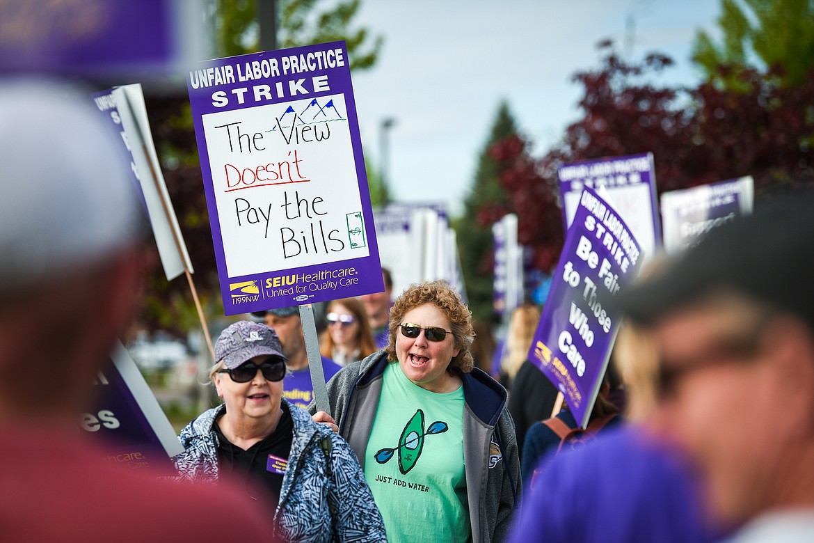 Nurses affiliated with SEIU Healthcare 1199NW and supporters march and hold signs during a strike outside Logan Health in Kalispell on Tuesday, June 1, 2021. (Casey Kreider/Daily Inter Lake)