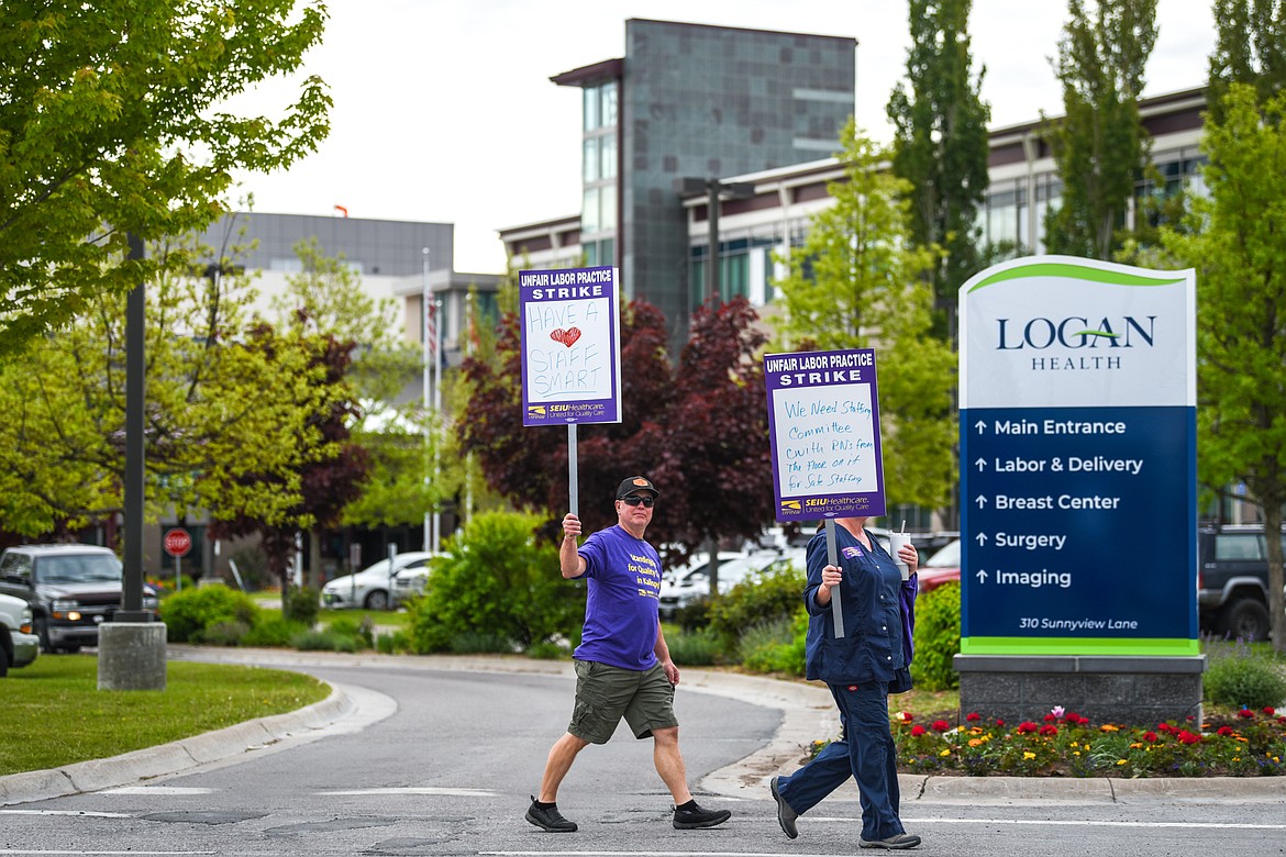 Nurses affiliated with SEIU Healthcare 1199NW and supporters march and hold signs during a strike outside Logan Health in Kalispell on Tuesday, June 1, 2021. (Casey Kreider/Daily Inter Lake)