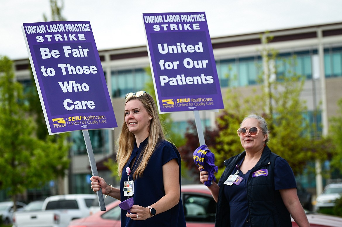 Nurses affiliated with SEIU Healthcare 1199NW and supporters march and hold signs during a strike outside Logan Health in Kalispell on Tuesday, June 1, 2021. (Casey Kreider/Daily Inter Lake)