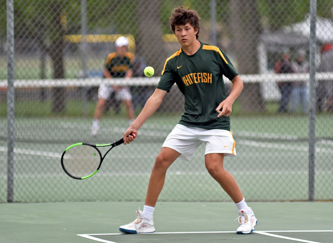 Bulldog Mason Kelch plays in a doubles match at the State A tennis tournament in Billings on Friday. (Whitney England/Whitefish Pilot)