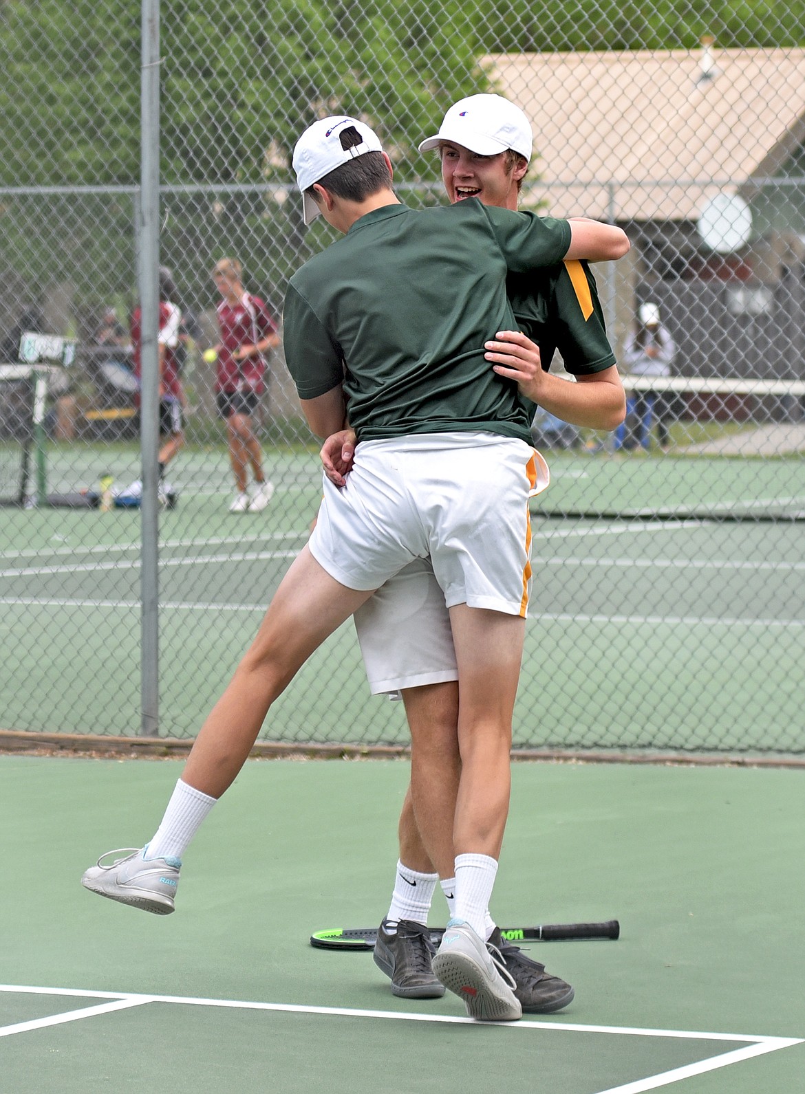 Whitefish's No. 1 doubles team of Aaron Dicks and Highland Lee-French celebrate a win the State A tennis tournament in Billings on Friday. (Whitney England/Whitefish Pilot)