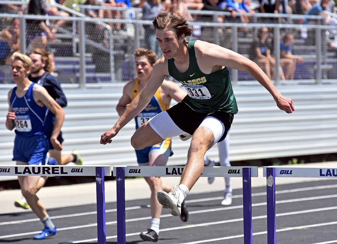 Whitefish's Bodie Smith runs to third place in the 100 meter hurdles at the Class A-B State track and field meet in Laurel on Saturday. (Whitney England/Whitefish Pilot)