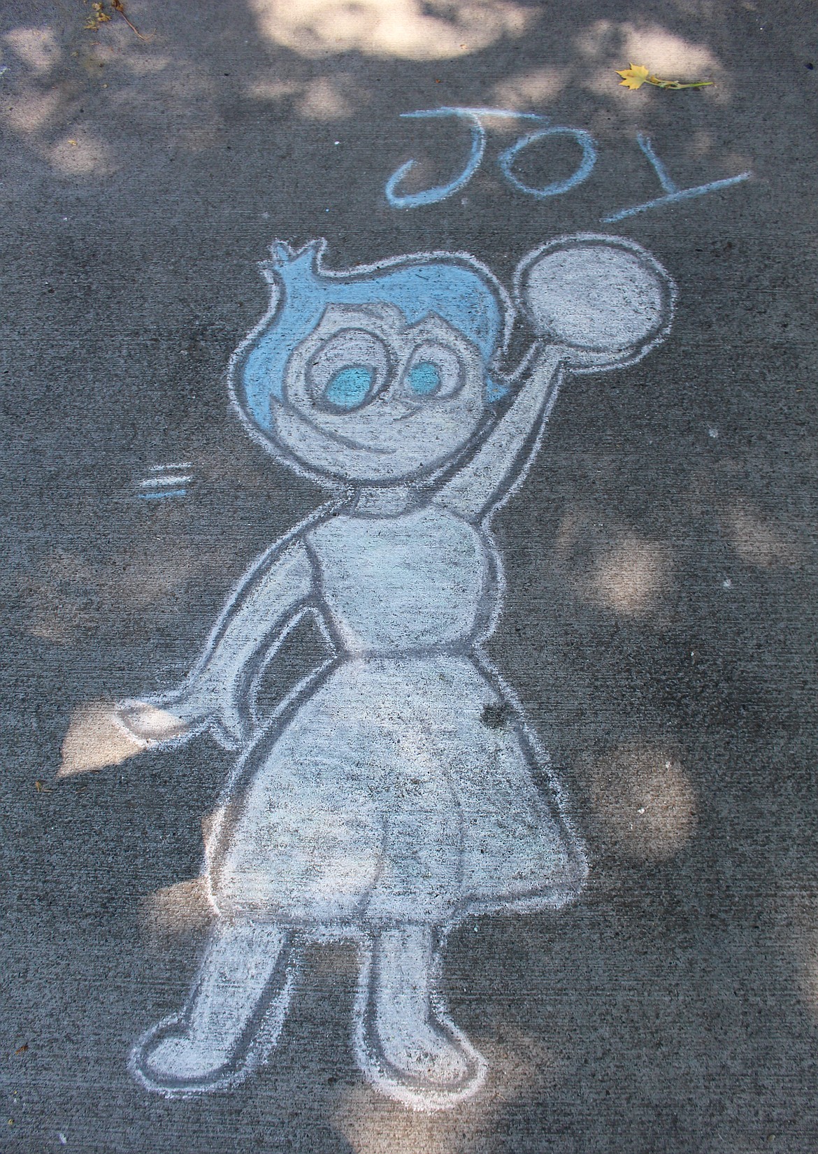 A chalk drawing of a character from the Pixar movie, "Inside Out," is one of a number of drawings on the driveway outside Tessa Pyle's family home in Moses Lake.