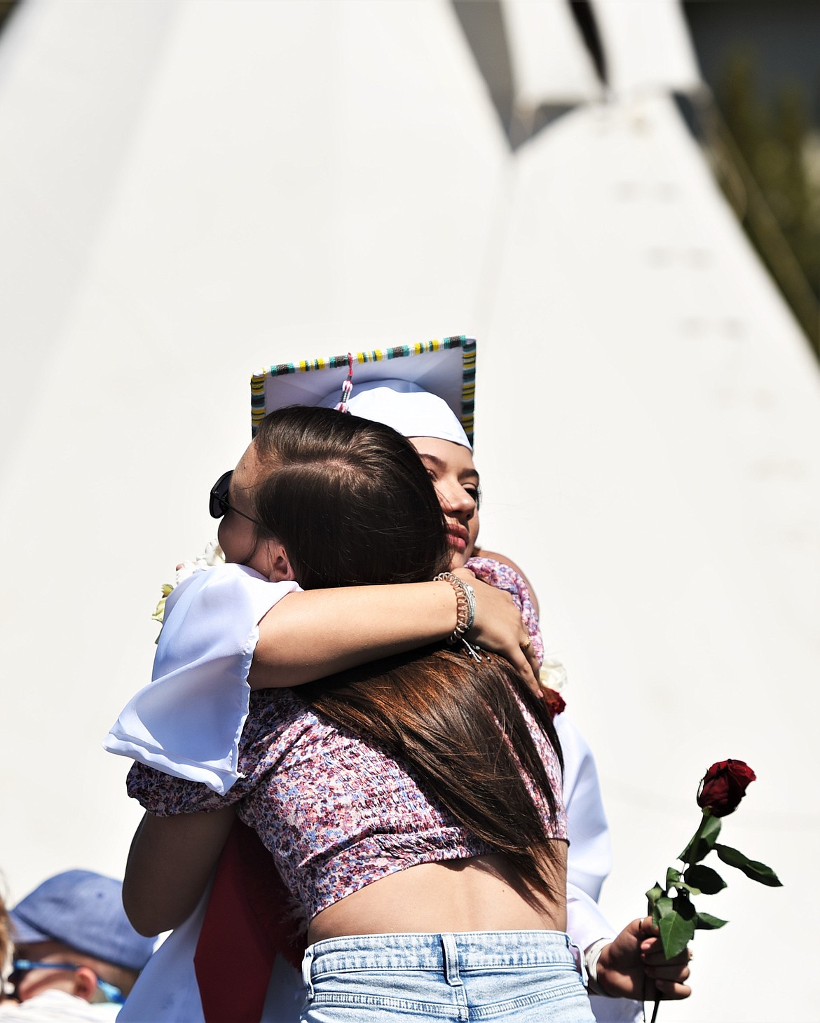 Students handed out roses to thank those who have supported them along the way. (Scot Heisel/Lake County Leader)