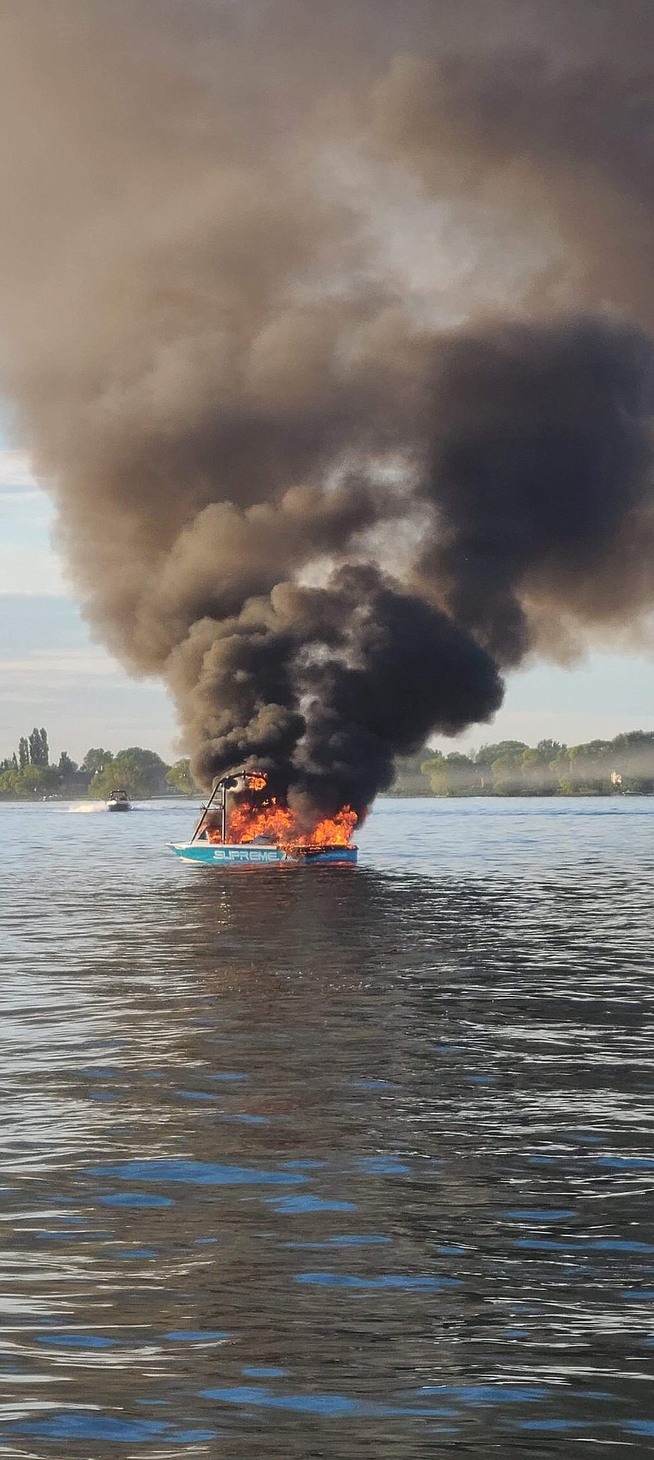 A boat burns on Moses Lake on Sunday, allegedly after its occupants harassed another boat flying pride flags.