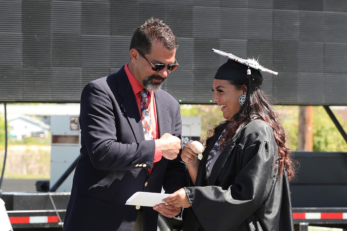 Ronan senior Madyson Running Crane receives her diploma. (Courtesy of Susan Lake)