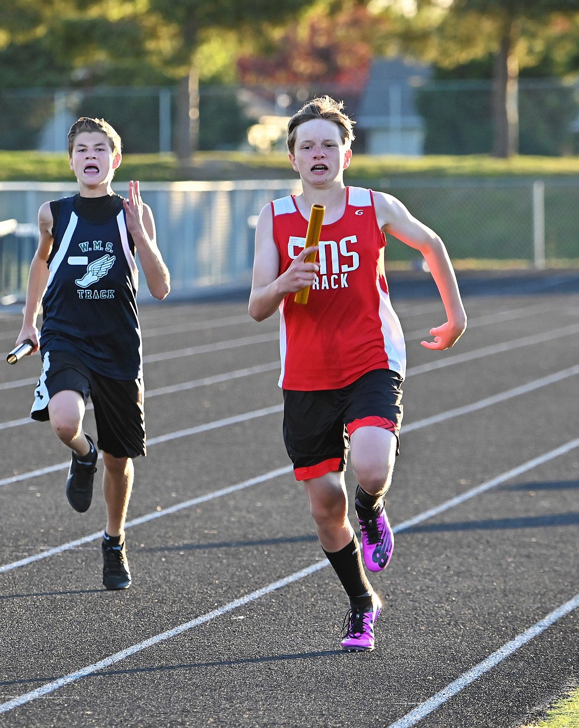 Seventh grader Isaac Schmit anchors the boys 4x200 relay during the middle school district track meet on May 13.