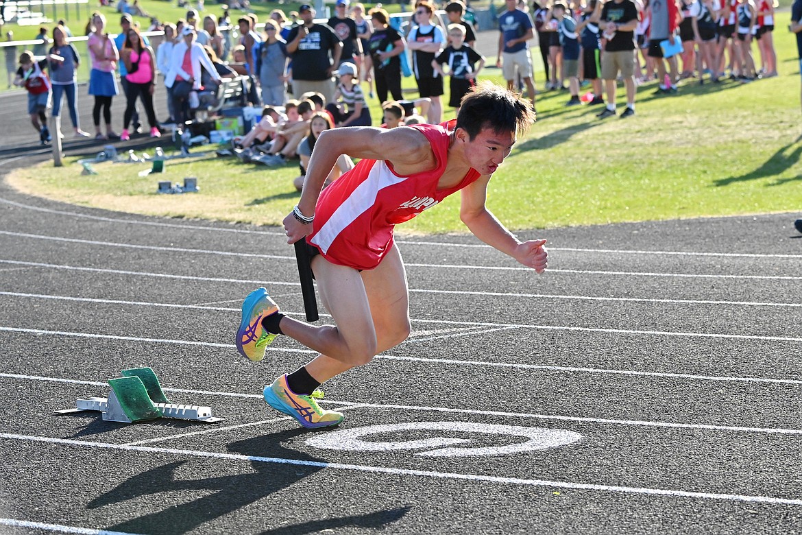 Eighth grader Luke Wykoff takes off from the blocks during the middle school district track meet on May 13.