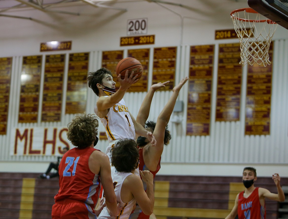 Cayden Hart flies into the lane for a layup for Moses Lake High School in the second half against West Valley on Tuesday evening at MLHS.