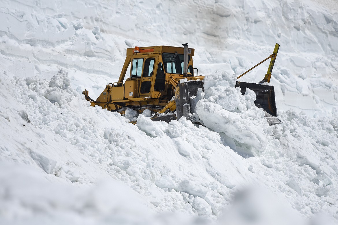 Road crews clear snow at the Big Drift on the Going-to-the-Sun Road near Logan Pass in Glacier National Park on Wednesday, June 2, 2021. (Casey Kreider/Daily Inter Lake)