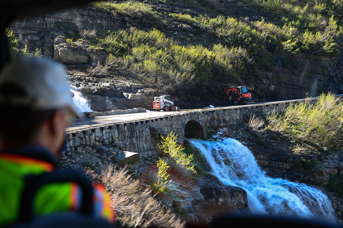 Glacier National Park road crews clear snow and debris in preparation for the installation of guardrails along the Going-to-the-Sun Road on Wednesday, June 2, 2021. (Casey Kreider/Daily Inter Lake)