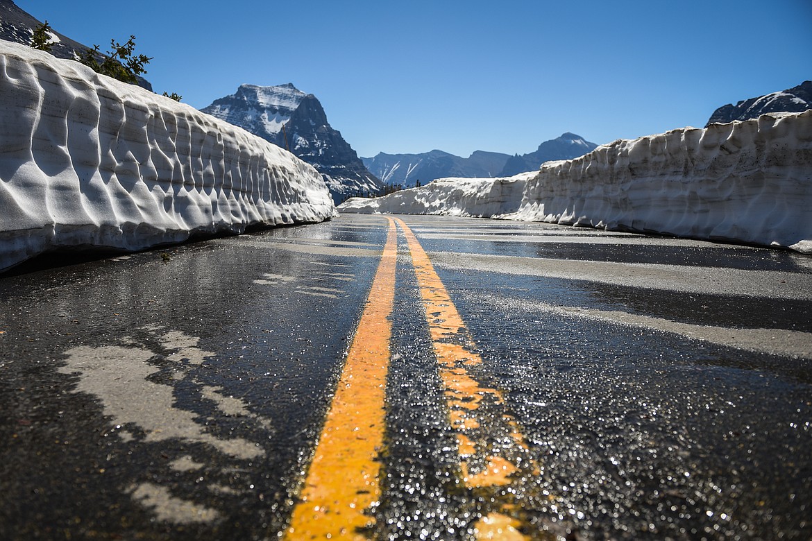Meltwater trickles across the Going-to-the-Sun Road near Logan Pass in Glacier National Park on Wednesday, June 2, 2021. (Casey Kreider/Daily Inter Lake)