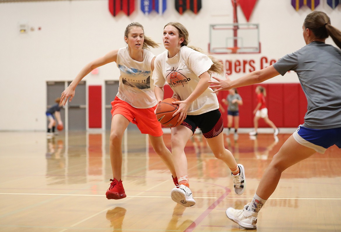 Daylee Driggs drives through the heart of the defense to attack the basket during practice on Thursday.