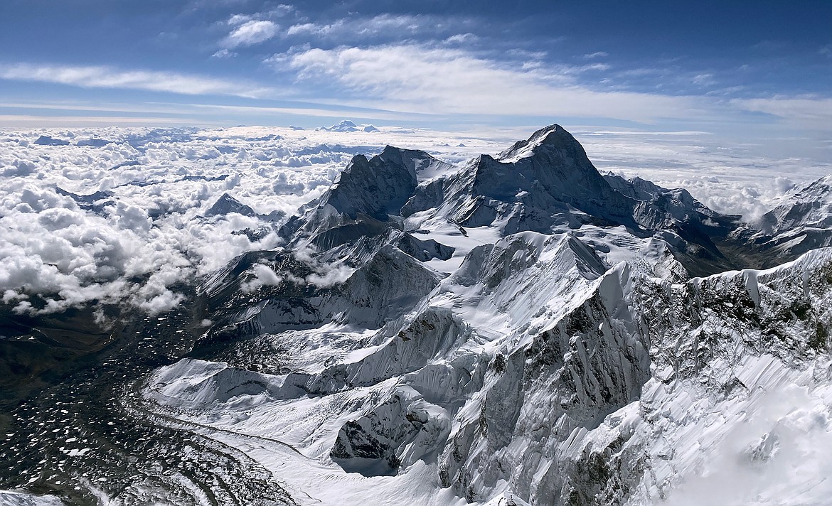 The view towards the southeast from the top of Mt. Everest. The fifth tallest mountain in the world, Makalu, sits below in the distance at 27,838 feet. (Photo courtesy of Steve Stevens)