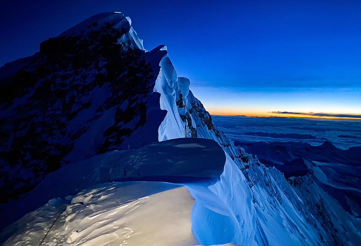 Daylight begins to fill the horizon behind the Cornice Traverse near the summit of Mt. Everest May 12. (Photo courtesy of Steve Stevens)