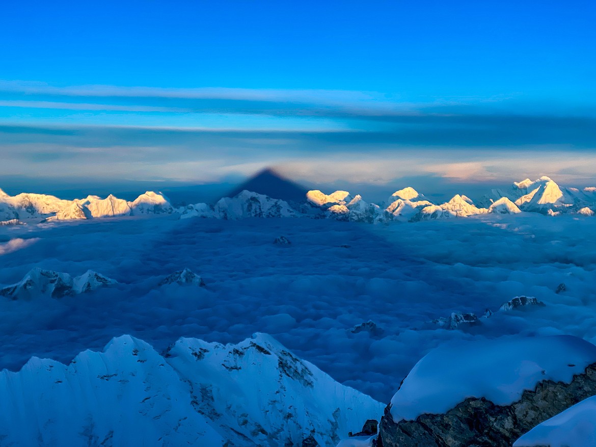 The shadow of Mt. Everest stretches across to the horizon as the sun rises over the Himalayas May 12. (Photo courtesy of Steve Stevens)