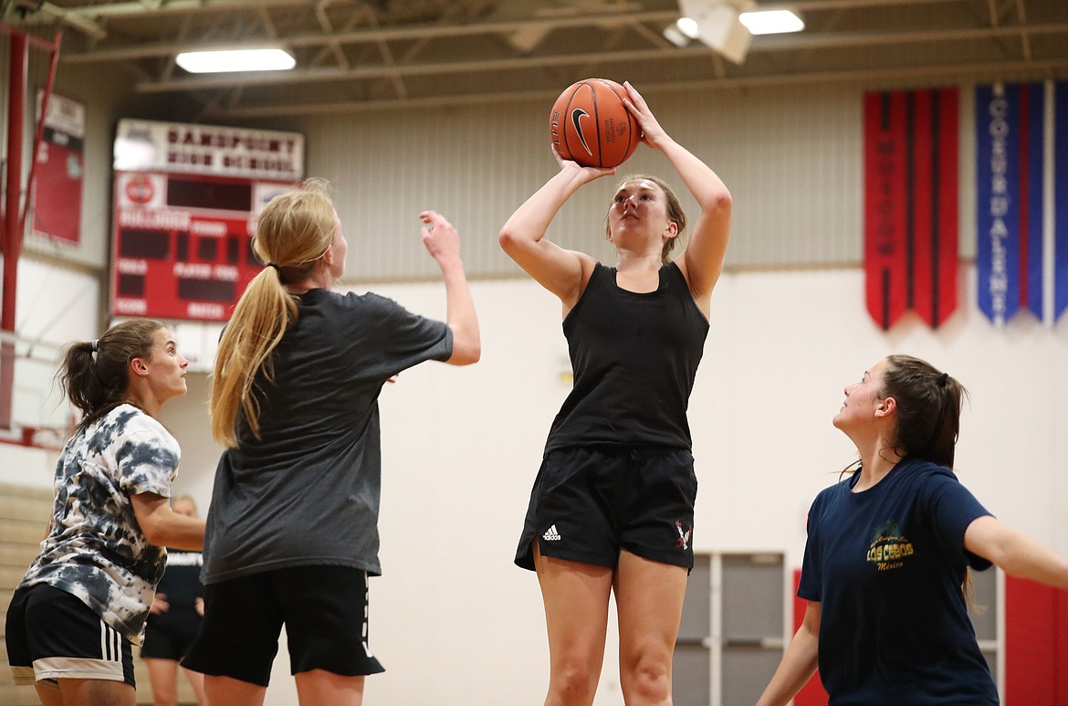 Grace Kirscher goes up for a jumper over a swarm of defenders during practice on Thursday.
