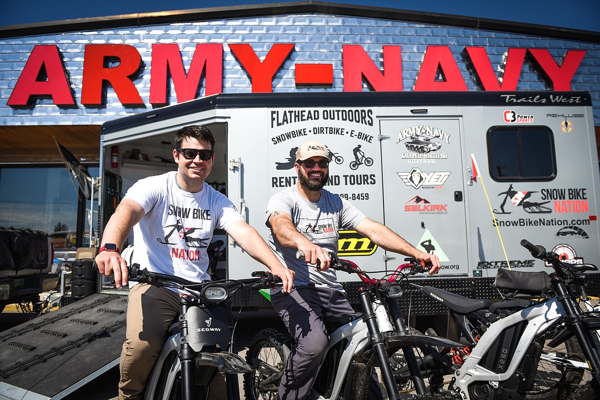 Brothers Garren and Kyle Allred outside their Flathead Outdoors trailer at the Army-Navy store in Evergreen on Friday, June 4. (Casey Kreider/Daily Inter Lake)