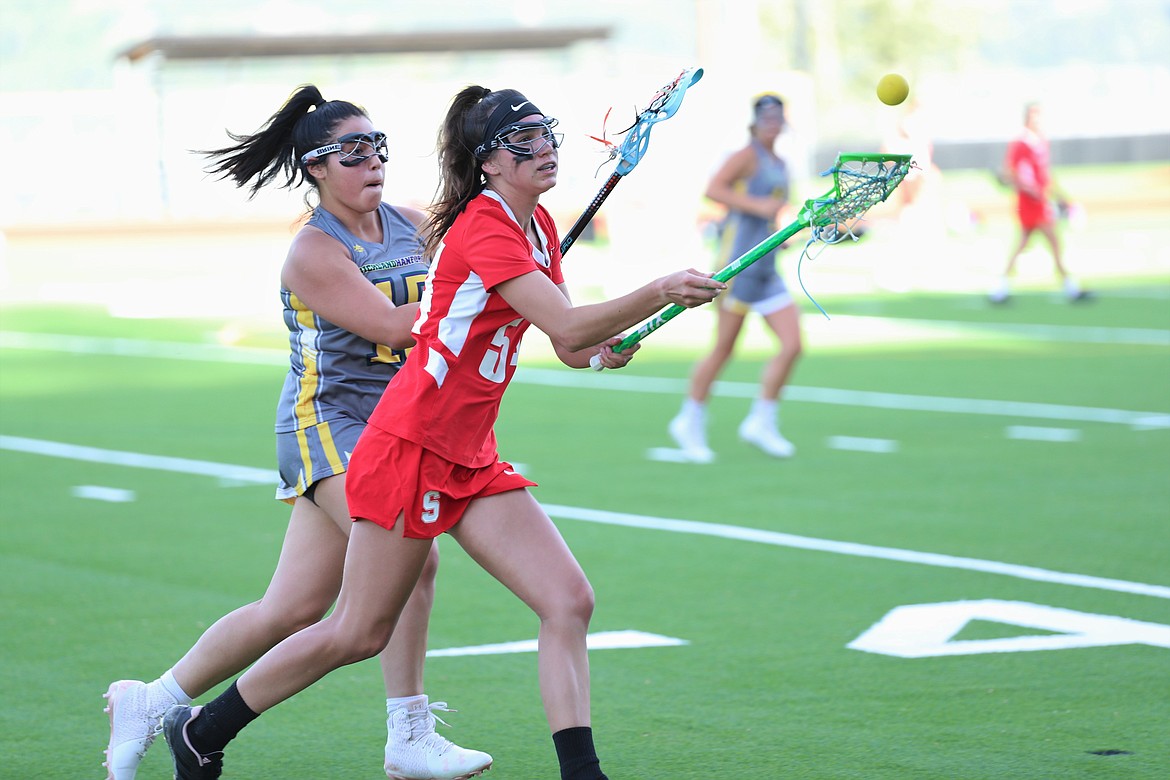 Saylor Bond tries to track down a loose ball during Friday's game at War Memorial Field.