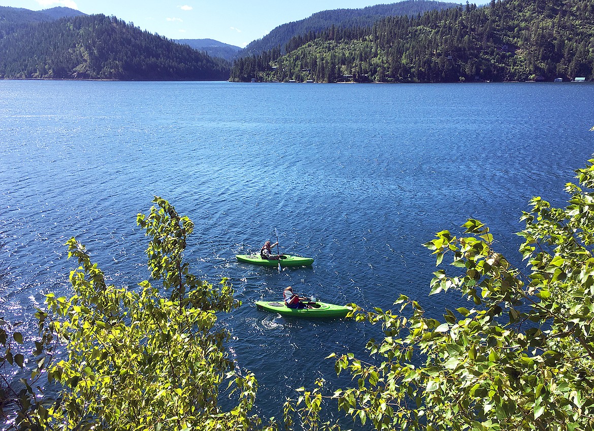 Kayakers paddle on Lake Coeur d'Alene at Higgens Point.
