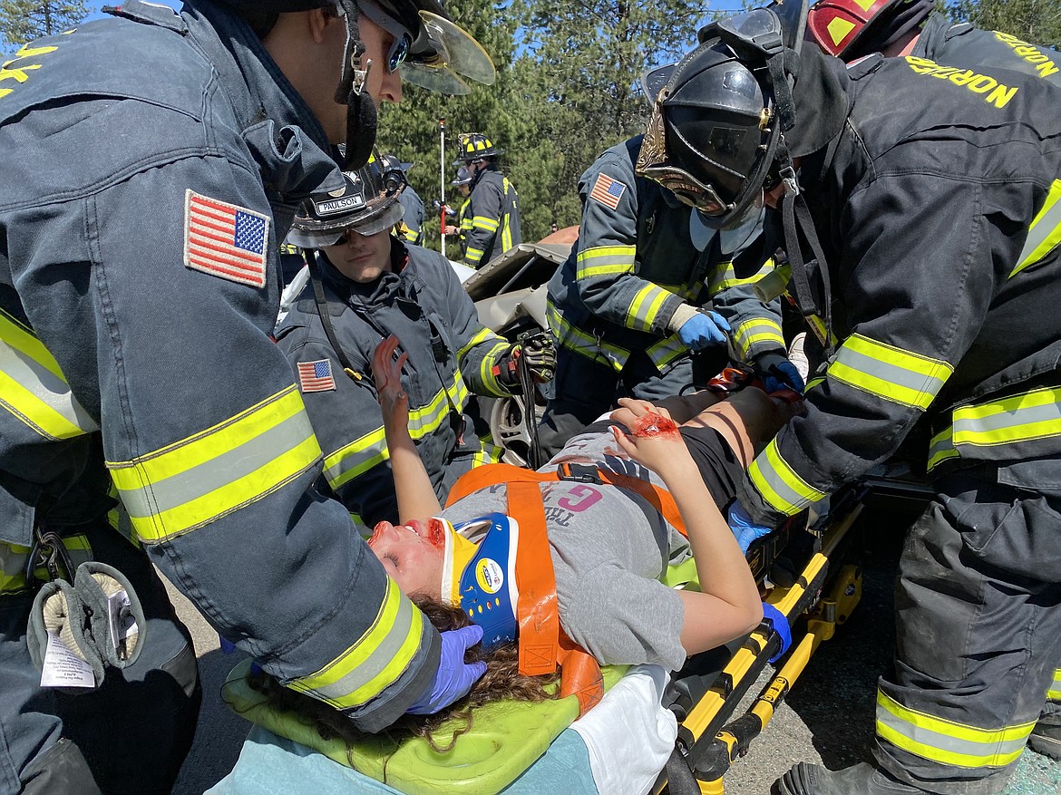 Lakeland High School senior Abbey Neff was pulled out of a crashed car Friday morning by Northern Lakes Fire District first responders during a mock DUI performance in front of the 2021 graduating class. (MADISON HARDY/Press)