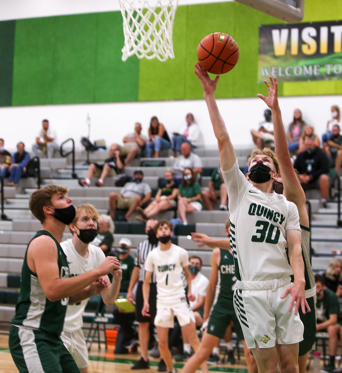 Aidan Heikes goes up for a shot for Quincy High School on Friday night in the 87-53 defeat to Chelan High School at home.