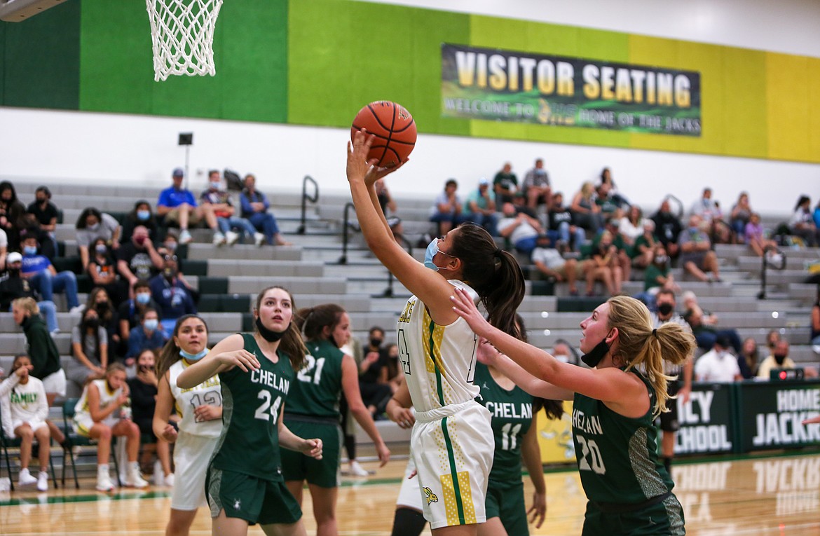 Karla Nunez goes up for a shot for Quincy High School against Chelan High School on Friday night at home.