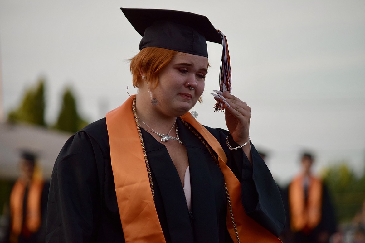 An emotional graduate walks across the field to pick up her diploma at Ephrata High School’s 2021 graduation on Friday.