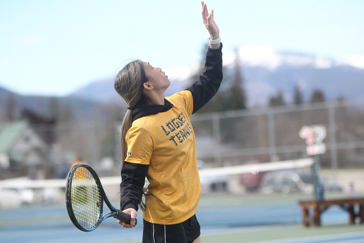 Ivy Pierce serves during the Lady Loggers top doubles match against Whitefish April 13. (Will Langhorne/The Western News)