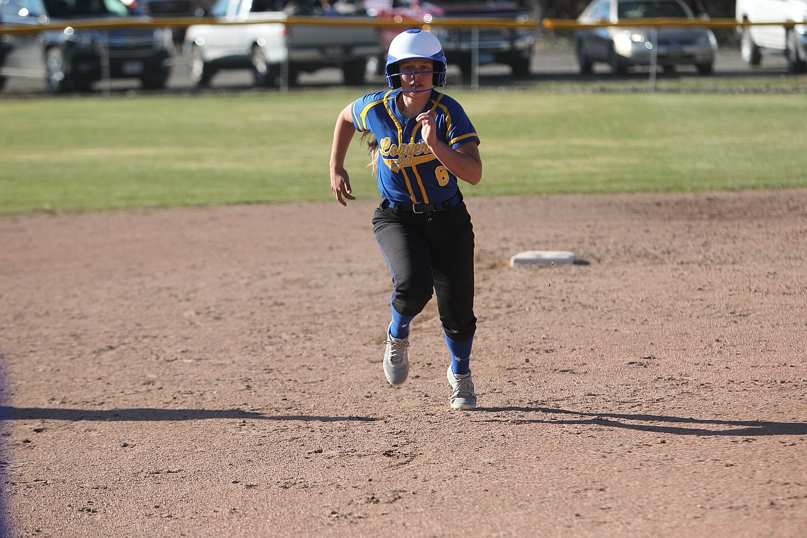 Kinzee Boehmler runs for third base during an April Lady Loggers game. (Will Langhorne/The Western News)