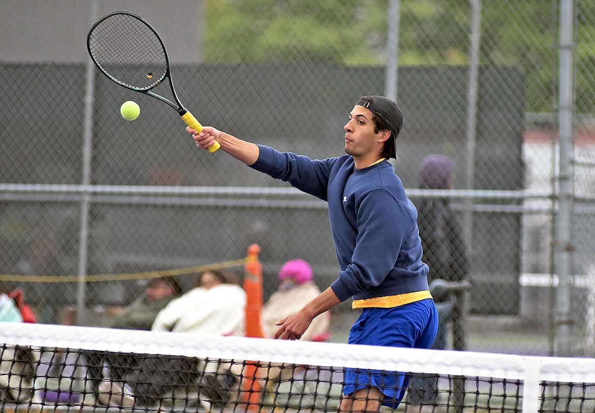 Michael Hollingsworth hits a volley in a closely contested match against Ronan's Beau Decker at the Western A Divisional Tennis Tournament in Polson on Friday. (Whitney England/Whitefish Pilot)