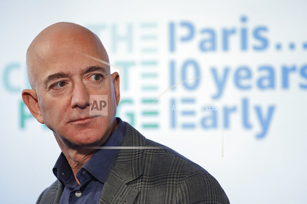 In this Sept. 19, 2019, file photo, Amazon CEO Jeff Bezos speaks during his news conference at the National Press Club in Washington. Bezos will be among the people on Blue Origin's first human space flight next month. The company said in a post Monday, June 7, 2021, that Bezos will be joined on the New Shepard flight by his brother Mark and the winner of an online auction. (AP Photo/Pablo Martinez Monsivais, File)