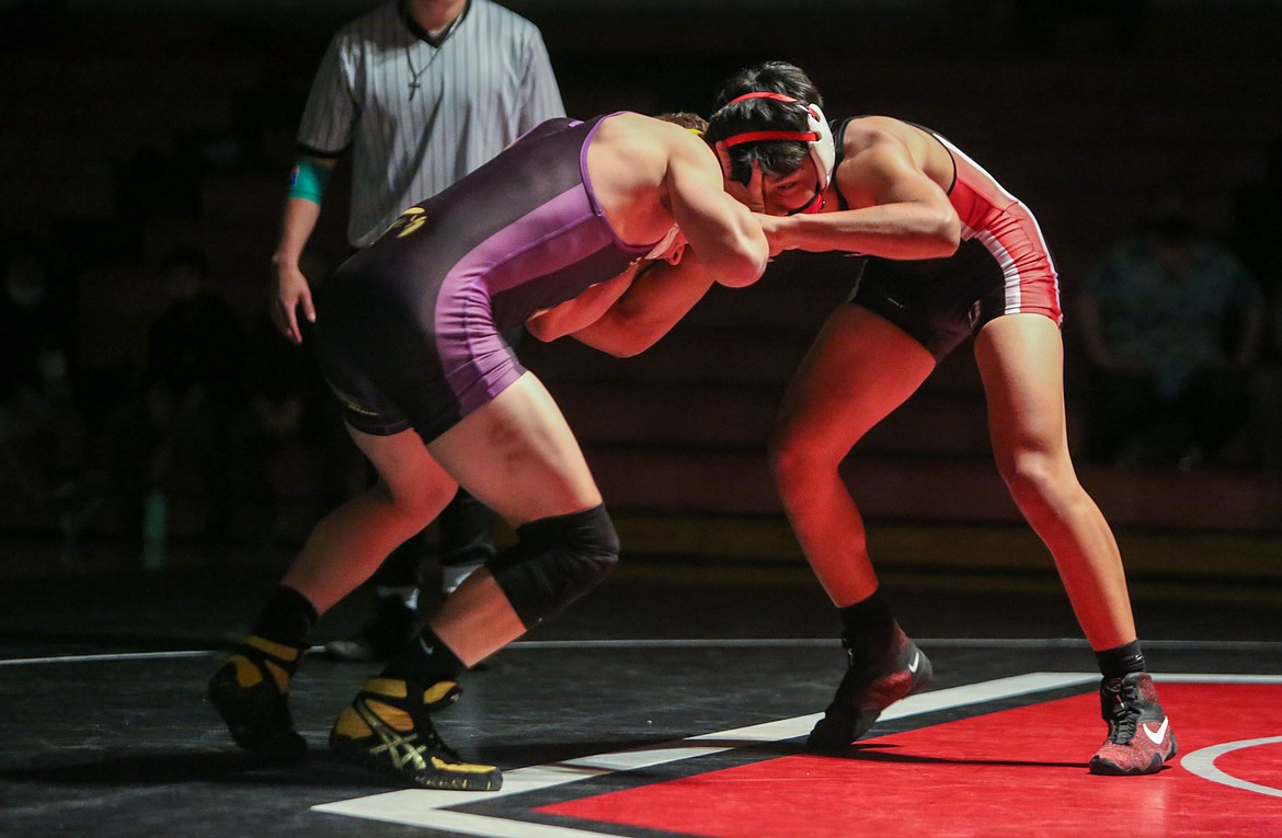 Senior Arturo Solorio grapples with his opponent on Senior Night Monday.