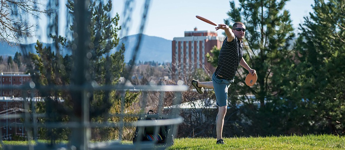 Trevor Pumnea, a University of Idaho graduate student, plays a hole of disc golf. Pumnea, who grew up in Priest River, has built and renovated disc golf courses across the region.