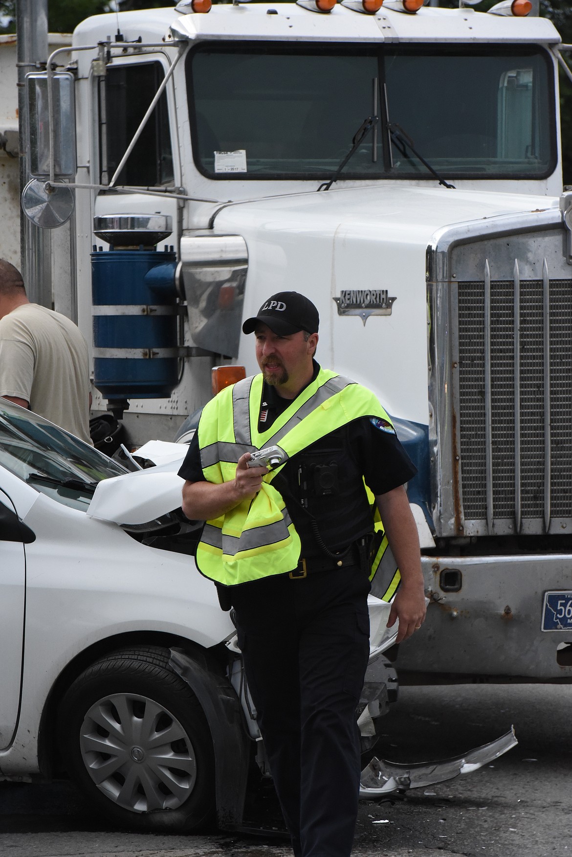 Libby Police officer Ronald Buckner at the scene of a traffic accident on June 8. (Derrick Perkins/The Western News)