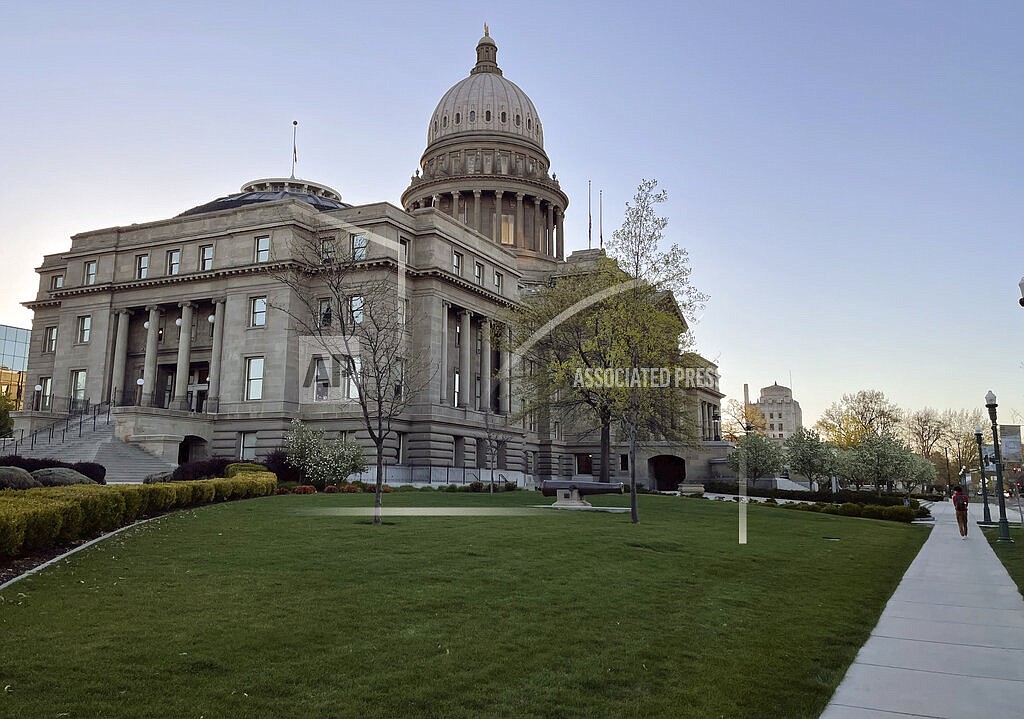 The Idaho Statehouse is seen at sunrise on April 20, 2021, in Boise, Idaho. Mainstream and far-right Republicans are battling for control of the party and the state in the deeply conservative state. (AP Photo/Keith Ridler)