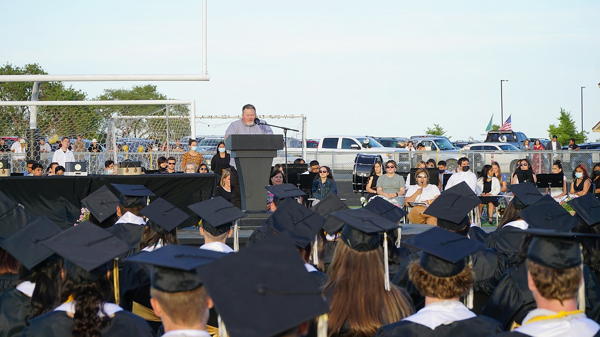 Royal High School teacher Jeremy Elliot addresses his students at graduation Friday.