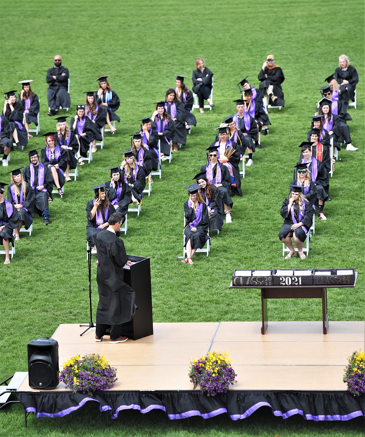 Polson High School science teacher Mike Sitter addresses the class of 2021 Saturday. (Scot Heisel/Lake County Leader)