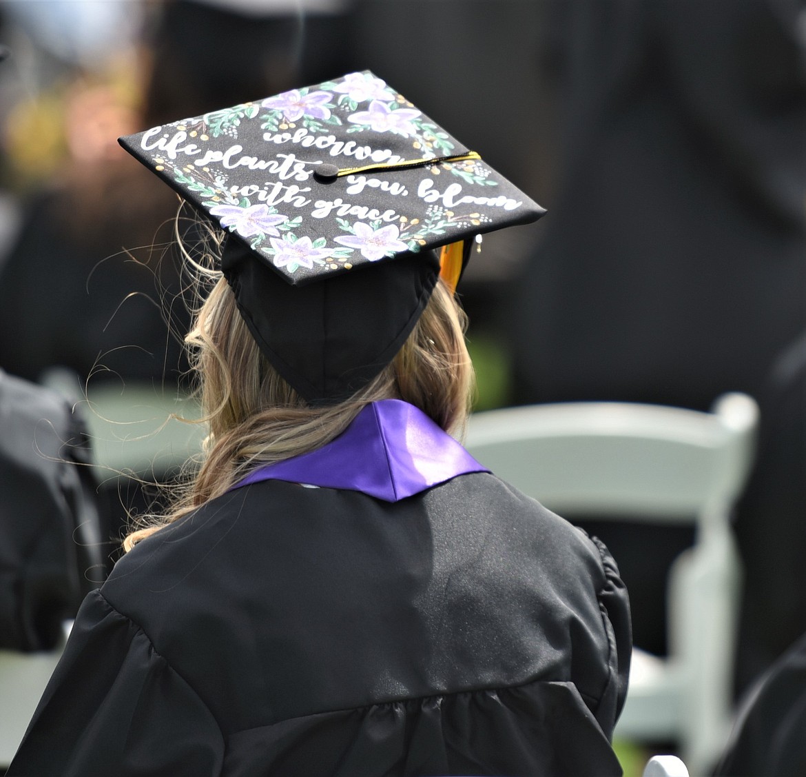 A Polson senior wears a decorated graduation cap with a floral theme. (Scot Heisel/Lake County Leader)