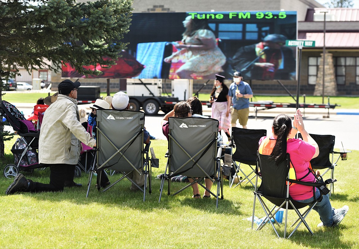 A large screen projection of Saturday's ceremony was available near the northeast parking lot in an effort to keep audience members spread out. (Scot Heisel/Lake County Leader)