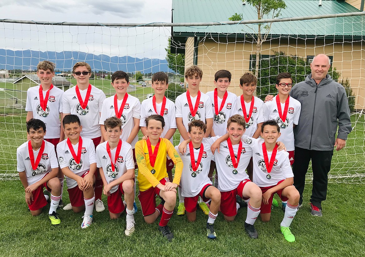 Courtesy photo
The Timbers North FC 08 Boys Red soccer played in the Three Blind Refs tournament in Kalispell, Mont., this past weekend. Early Saturday they defeated Flathead Rapids Black 2007 Boys 9-0. Reese Crawford led the Timbers with a hat trick. Madden Bear had two goals. Brett Johnson had one goal and an assist. Jack Jenkins, Bear Coleman and Charlie Dircksen each scored a goal. Mitchell Reitze, Jaxon Fantozzi and Reilly Smith each had an assist. Orion Burns was in goal for the shutout. Later that day, the Timbers beat Missoula Strikers 2007 Boys 2-1. Wyatt Carr scored two goals and Isaac Lowder had two assists for the Timbers. Orion Burns was in goal. On Sunday they won 3-1 over Helena Arsenal 2008 Boys. Isaac Lowder, Reese Crawford and Mitchell Rietze each had a goal for the Timbers. Jaxon Fantozzi and Joshua Rojo each had an assist. Joshua Rojo and Orion Burns teamed in goal. Timbers North came in second place to Missoula Strikers 2007 Boys in the championship game. In the front row from left are Preston Samayoa, Joshua Rojo, Parker Sterling, Orion Burns, Brett Johnson, Drake Flowers and Jack Jenkins; and back row from left, Reilly Smith, Bear Coleman, Charlie Dircksen, Isaac Lowder, Reese Crawford, Wyatt Carr, Mitchell Rietze, Jaxon Fantozzi and coach Mike Thompson. Not pictured is Madden Bear.