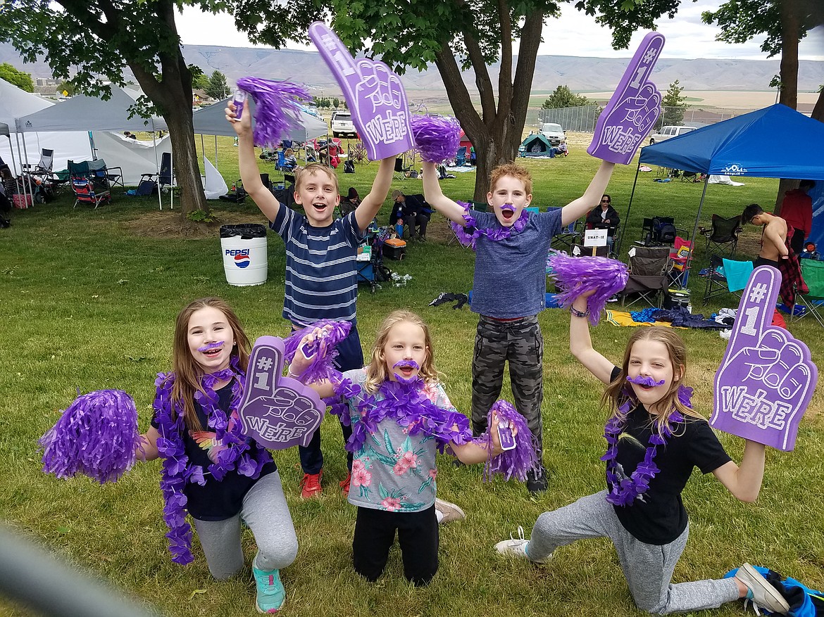 A group of five kids cheer on the Sharks during the first meet of the season in Lewiston. Back row (from left): Eli Norling and Olli Leavitt. Front row (from left): London Leavitt, Claire Ballard and Allyson Ballard.