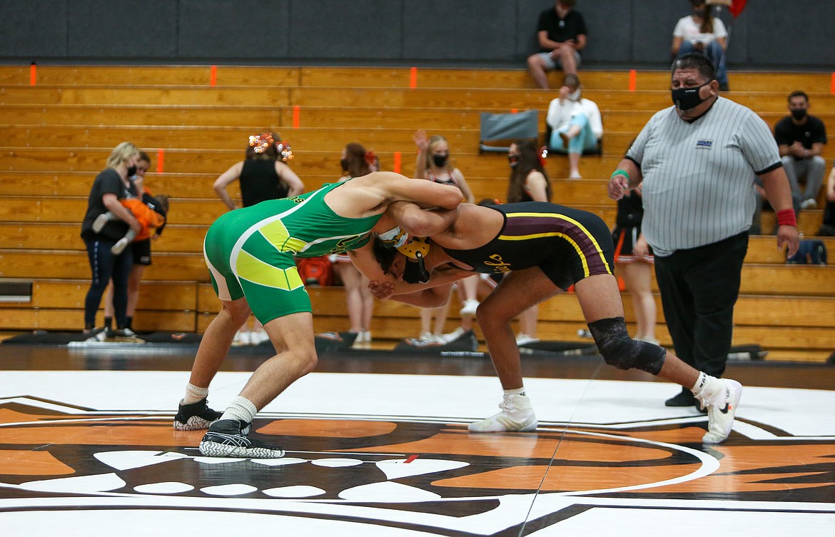 Moses Lake senior Maximus Zamora locks in with his opponent from Liberty Bell High School in an exhibition matchup Tuesday at Ephrata High School.